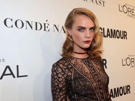 Cara posing for a camera